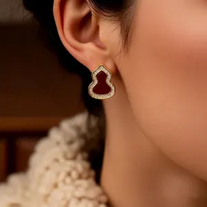 Vintage red enamel Wu Lou stud earrings with zircon inlay and gold finish for women
