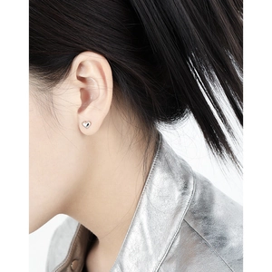 Minimalist silver heart stud earrings for women with polished finish and modern look
