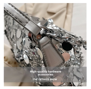 Close-up of premium silver metal hardware and chain on a sequined handbag