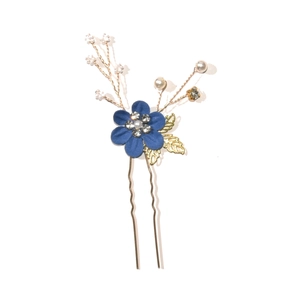 Detail of blue fabric flower U-shaped hairpin with rhinestones and gold leaves