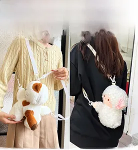 Close-up of cute plush calico cat and sheep bags with adjustable fabric straps