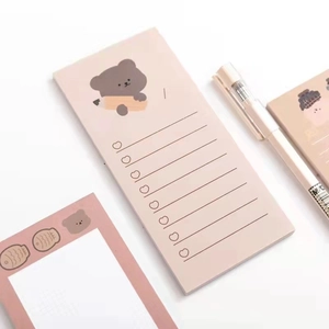 Cute pink bear stationery set with portable memo pad and checklist on white background