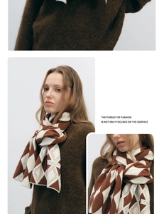 Detail view of a premium knit scarf with brown and white argyle pattern and soft texture
