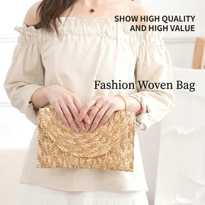 Minimalist straw woven clutch bag in natural beige color for summer travel and vacation