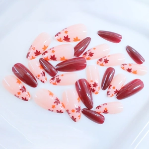 Glossy autumn maple leaf press-on nails in burgundy red and almond shape set
