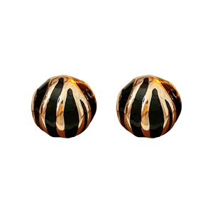 Classic round stud earrings featuring vintage gold and black enamel striped textures