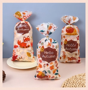 Detail of Hello Autumn gift bags featuring maple leaves and foxes for Thanksgiving