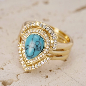 Bohemian pear-cut turquoise ring with zircon halo and golden multi-layer band