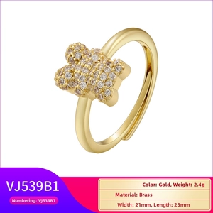Detail view of gold butterfly brass ring with white zircon insets and 21mm dimensions