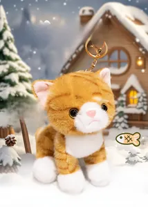 Detail of cute orange striped plush cat keychain with soft fur and golden metal ring