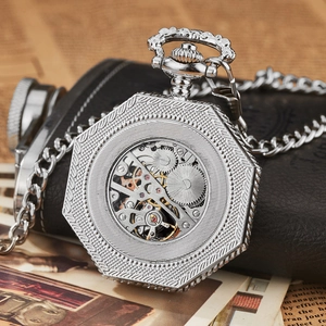 Macro shot of silver octagonal mechanical pocket watch with hollow movement and chain