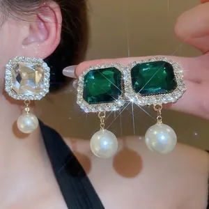 Luxurious multi-layer pearl choker with green crystal square pendant and diamond accents