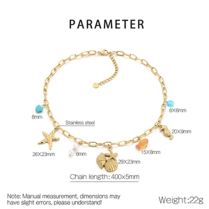 Detailed view of stainless steel ocean charm necklace with blue hearts and seashells