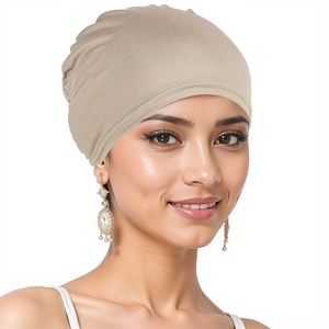Close-up of beige turban hat for women showing soft texture and comfortable head fit