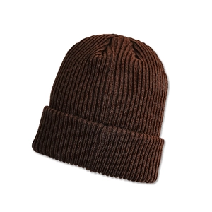 Close-up of deep brown ribbed knit beanie with wide folded cuff for winter warmth