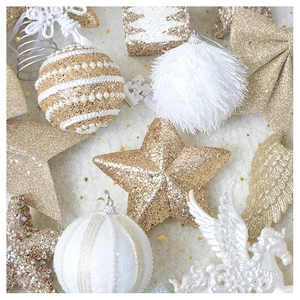 Detailed view of champagne gold and white Christmas tree ornaments with sequins and glitter