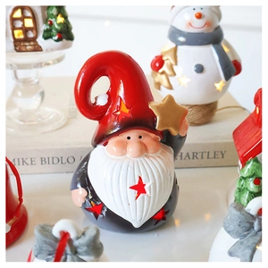 Macro shot of a glowing Christmas Gnome ornament with star cutouts and festive warm lighting