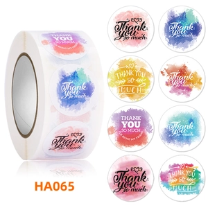 Detailed view of round watercolor Thank You stickers in a roll with various gradient colors