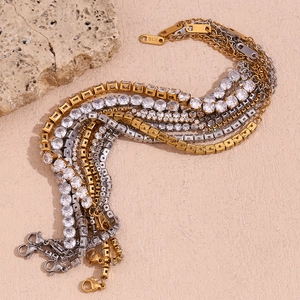 Detailed macro view of 18K gold plated tennis bracelets with sparkling pavé zircons