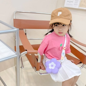 Girl's purple camellia silicone crossbody bag styled with trendy casual summer outfit