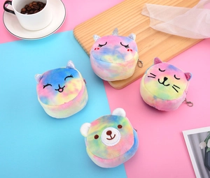 Close-up of mini rainbow plush animal coin purses with embroidery and metal keychains
