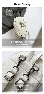 Detail of white gothic backpack with metallic cross logo and adjustable straps