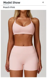 Front view of peach pink sports set with V-neck camisole and high-waist yoga shorts