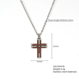 Detail view of silver cross necklace with a brown center piece and a small diamond