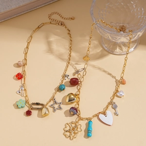 Two-piece gold beaded necklace set featuring heart flower key charms and resin stone beads