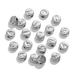 Close-up of silver stainless steel round beads with engraved numbers 0-9 for DIY jewelry