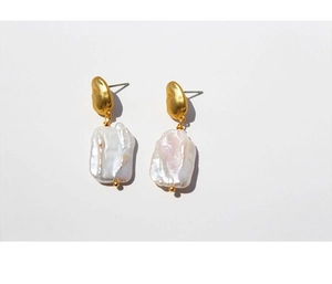 Detail view of vintage baroque pearl earrings with matte gold irregular metal elements