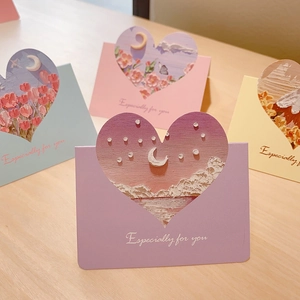 Macro detail of 3D embossed oil painting greeting cards with heart-shaped envelope windows