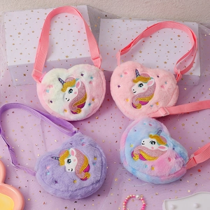 Detailed view of plush heart-shaped kids bags with unicorn embroidery and sequins