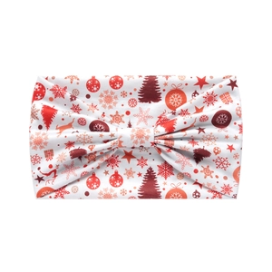 Detail of Christmas headband showing reindeer and snowflake patterns on white elastic fabric
