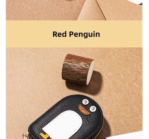 Close-up of penguin card holder with black litchi grain leather and metal zipper