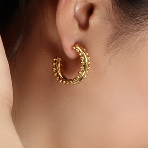 Bohemian 18K gold plated hoop earrings with delicate beaded edge on female model