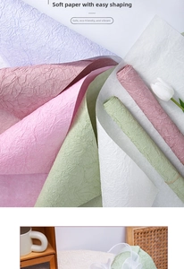 Detail showing the pleated texture and pastel colors of handmade floral wrapping paper