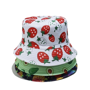 Summer bucket hats with tropical strawberry avocado and pineapple fruit print patterns