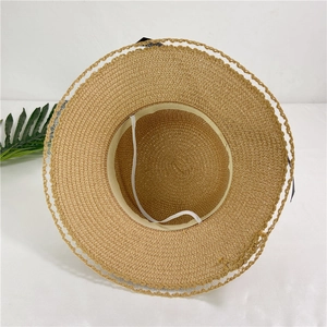 Women's summer woven straw sun hat with wide brim, lace edge and black bow decoration