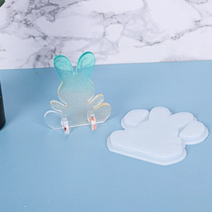 Detail showing rabbit silicone mold and a sparkling gradient resin phone stand