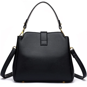 Elegant black quilted leather bucket bag with top handle and gold hardware accessories