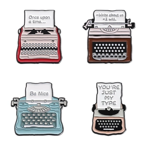 Set of 4 vintage typewriter enamel pins in red, brown, blue and pink for clothing accessories