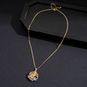Detail of 18K gold-plated hollow flower pendant necklace with colorful zircons