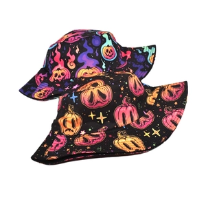 Detail view of Halloween bucket hat with neon pumpkin prints and star patterns
