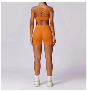 Rear view of orange high-waisted yoga shorts with seamless fit and breathable fabric