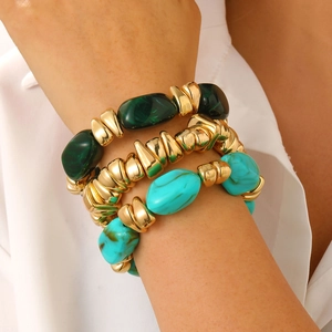 Bohemian multilayer bracelet set featuring green and blue resin beads with chunky gold accents