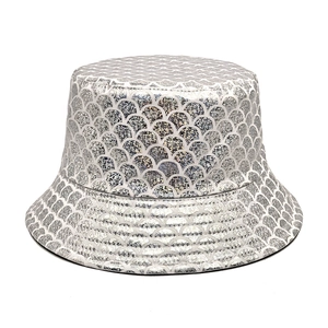 Close-up of shiny silver mermaid scale sequins on a reversible bucket hat for summer
