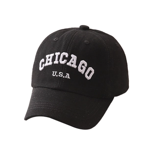 Black cotton baseball cap with white Chicago embroidery in a stylish 45-degree side view