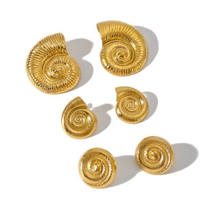 Golden sea shell earrings set with textured spiral conch and snail shell designs
