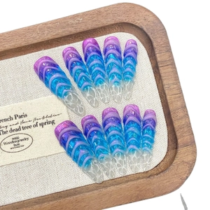 Blue-purple gradient press-on nails with 3D wave texture in long almond shape